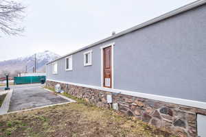 View of side of home featuring a mountain view