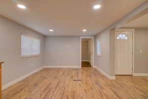 Foyer entrance with light hardwood / wood-style floors