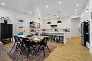 Dining room featuring light wood-type flooring