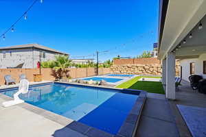 View of swimming pool with a patio area