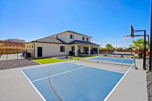 View of basketball court featuring tennis court