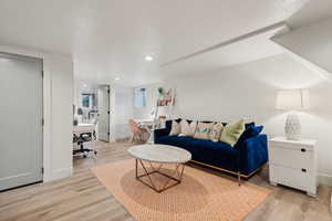 Living room with light hardwood / wood-style flooring