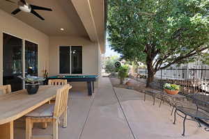 View of patio featuring ceiling fan