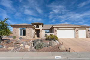 View of front of property with a garage