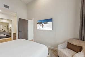 Bedroom featuring a high ceiling