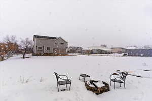 View of yard layered in snow