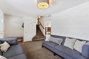 Living room featuring dark carpet