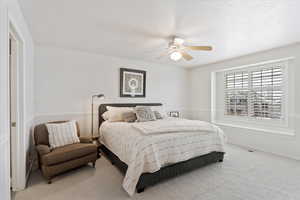 Bedroom featuring carpet flooring and ceiling fan