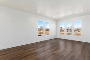 Spare room featuring dark hardwood / wood-style flooring