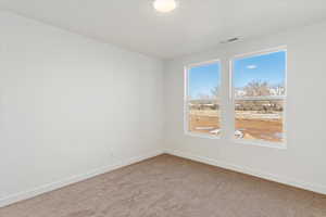 Empty room featuring carpet flooring