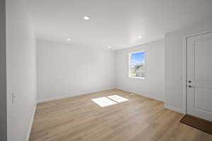 Spare room with light wood-type flooring