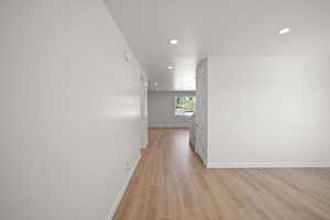 Hallway featuring light wood-type flooring