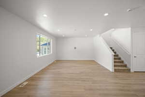 Unfurnished living room with light hardwood / wood-style flooring