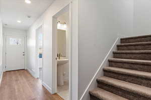 Foyer entrance with light wood-type flooring