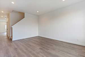 Unfurnished room with light hardwood / wood-style floors