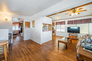 Living room with hardwood / wood-style floors and ceiling fan