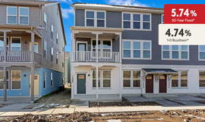View of front of house featuring a balcony