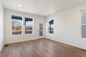 Unfurnished room with plenty of natural light and light hardwood / wood-style floors