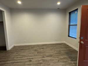 Spare room featuring dark hardwood / wood-style flooring