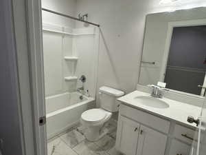 Full bathroom featuring vanity, toilet, and shower / washtub combination