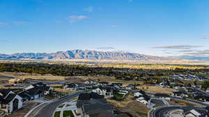 Birds eye view of property with a mountain view