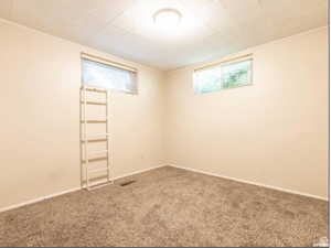 Empty room with carpet flooring