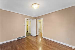 Empty room with wood-type flooring