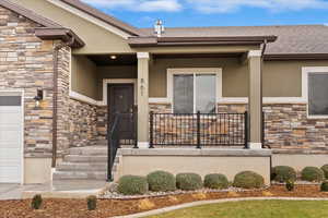 Doorway to property with a porch