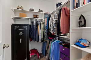 Walk in closet featuring carpet flooring