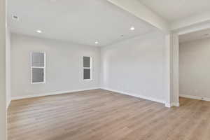 Spare room featuring light wood-type flooring