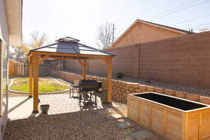 View of patio with a gazebo and grilling area