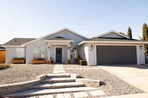 Single story home featuring a garage