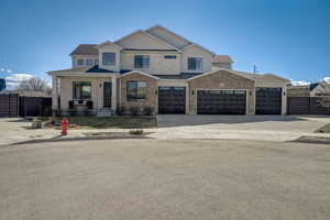 View of front facade with a garage and covered porch