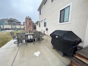 View of patio / terrace with a playground and grilling area