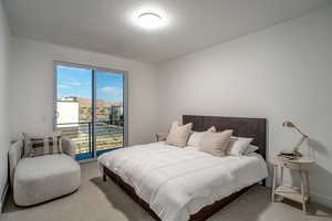 Bedroom with access to exterior deck with views of Redrock