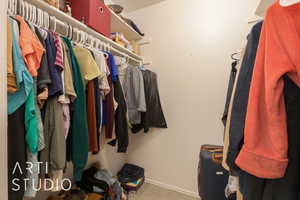 Walk in closet featuring carpet flooring