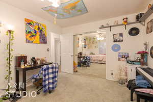 Bedroom featuring a closet and light colored carpet