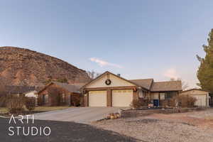 Ranch-style house with a mountain view and a garage