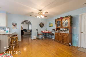 Dining space featuring ceiling fan and light wood-type flooring