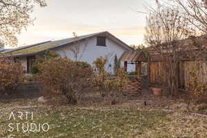 View of property exterior at dusk