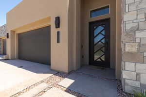 Entrance to property with a garage