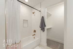 Bathroom with shower / bath combination with curtain