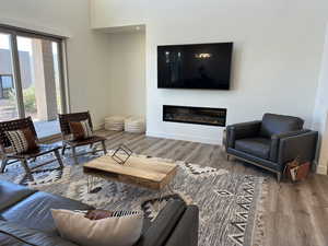 Living room with hardwood / wood-style flooring