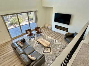 Living room with hardwood / wood-style flooring