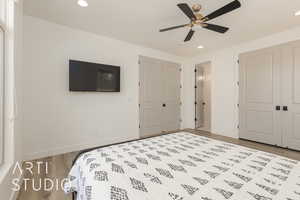 Bedroom #2 featuring a closet, light hardwood / wood-style flooring, and ceiling fan