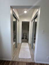 Hallway with light wood-type flooring