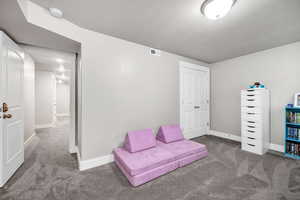 View of carpeted bedroom with closet