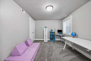 View of carpeted bedroom with closet