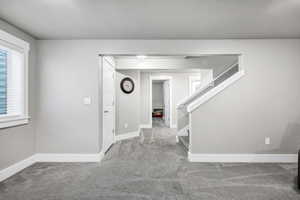 View of carpeted entrance foyer