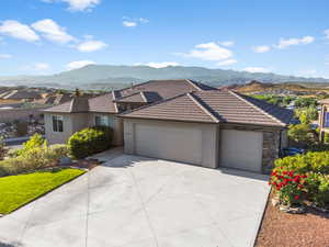 Ranch-style house featuring a mountain view and a garage